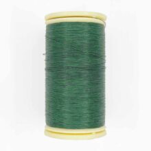 spool of sajou fil a gant au chonois waxed cotton gloving thread 820 pine