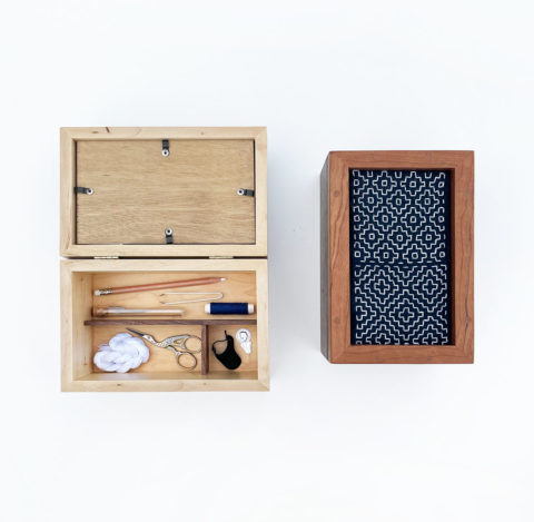 two wooden sashiko keepsake boxes with frame lids, one of which is propped open to revealed divided interior compartments