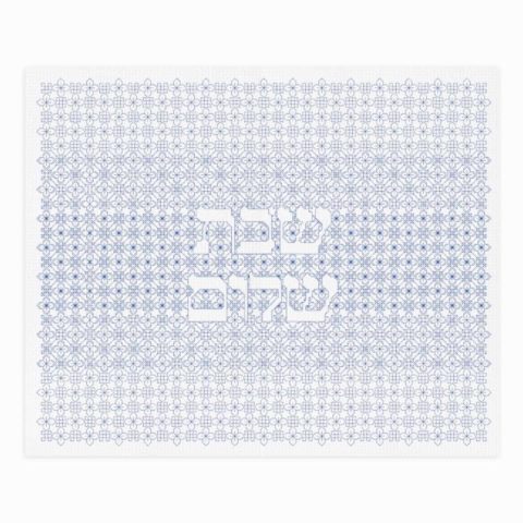 A white challah cover with the words shabbat shalom surrounded by blackwork embroidery in blue