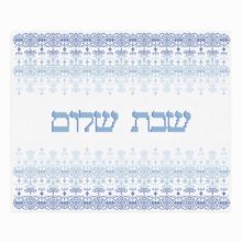 blue and white geometric cross stitch pattern in middle eastern style stripes with the hebrew words shabbat shalom in the center
