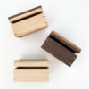three wooden keepsake boxes shown from the front with their hinged lids slightly ajar