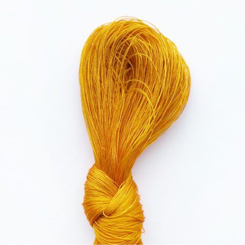 a bundle of fine yellow silk thread
