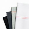 Zweigart aida cloth in white, light grey, dark grey, and black